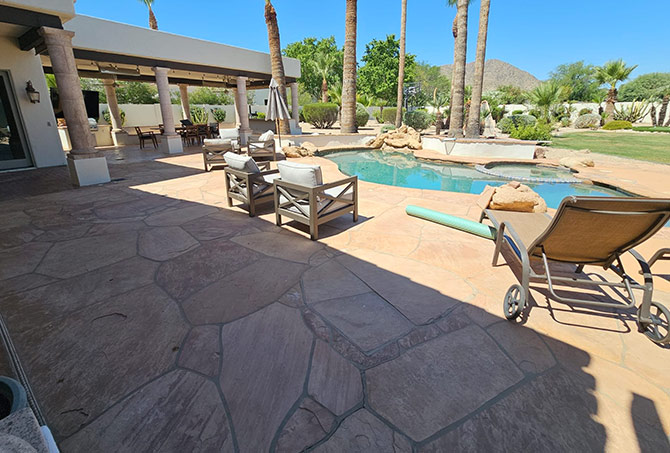 In this BEFORE image, the pool and patio area is lovely but needs some professional TLC.